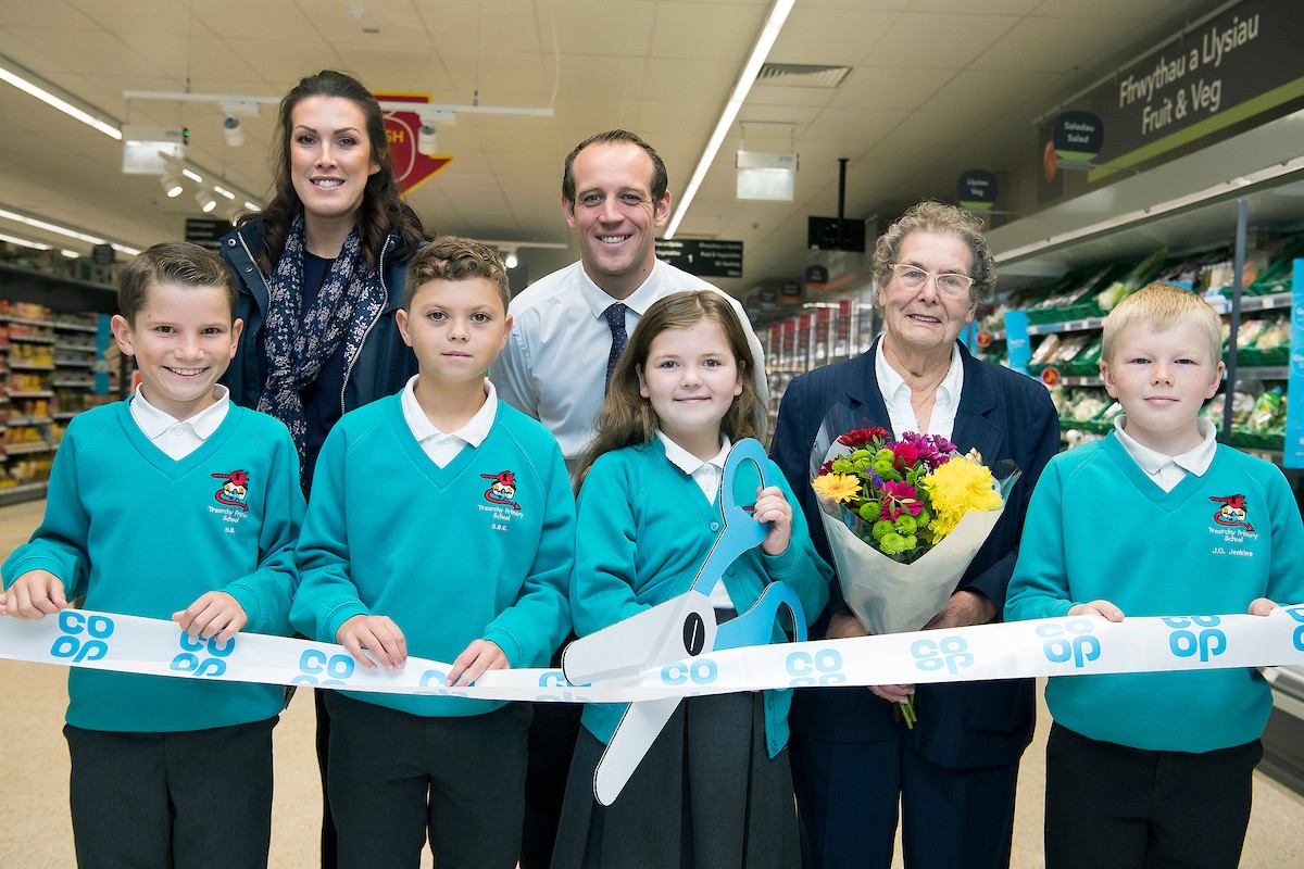 With Regional Manager Erin O’Mahony and Store Manager Daryl Hodges are children of Treorchy Primary School, long standing Co-op Member Sylvia Jones. Sylvia Jones was presented with a bunch of flowers, and a Co-op hamper to donate to a charity of her choice.