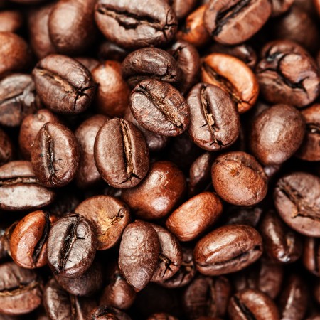 Brown coffee beans, close up of coffee beans for background and texture macro