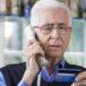 Senior Man Giving Credit Card Details On The Phone